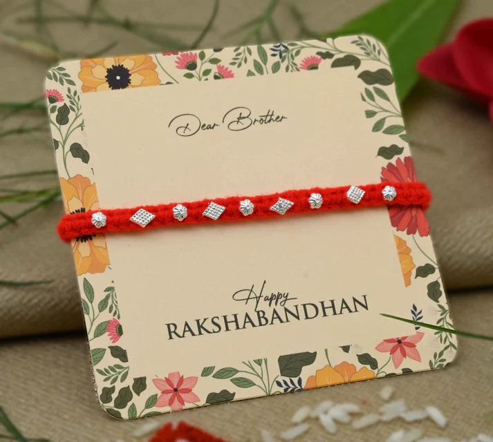 Silver Small Flower Design with Orange Thread Rakhi for Boys