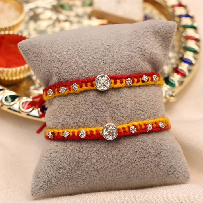Swastik Charm Rakhi in Silver