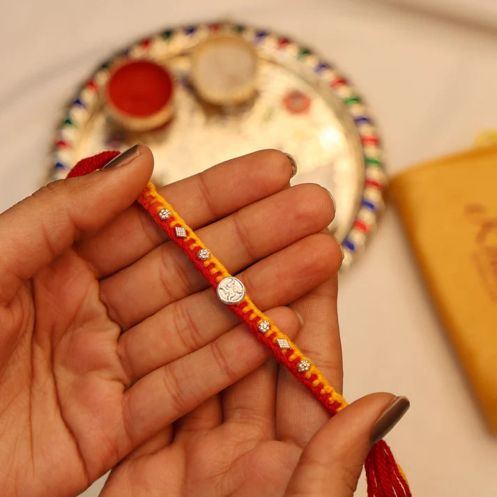 Swastik Charm Rakhi in Silver